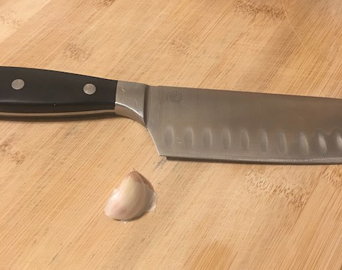 Garlic clove and knife