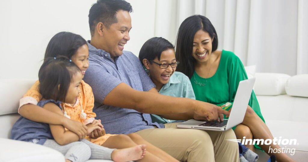 family looking at computer